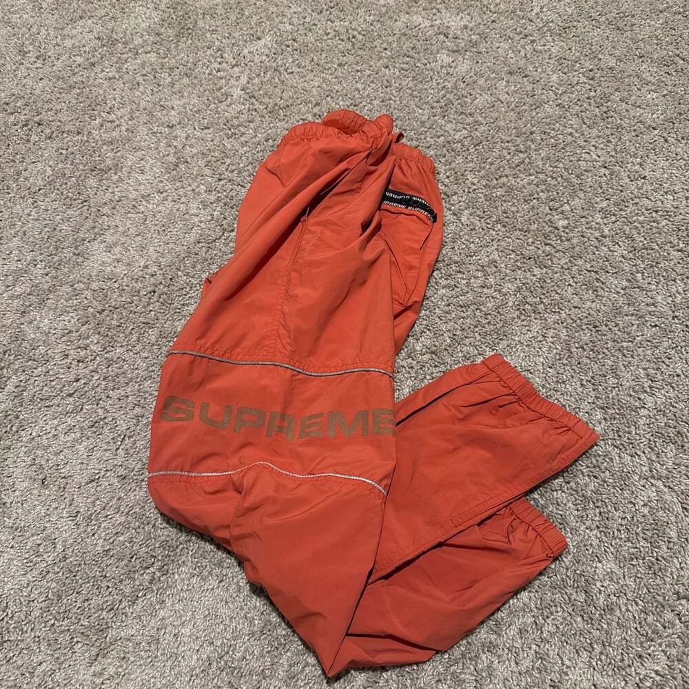 Supreme Nylon Reflective Logo Track Pants. Orange....
